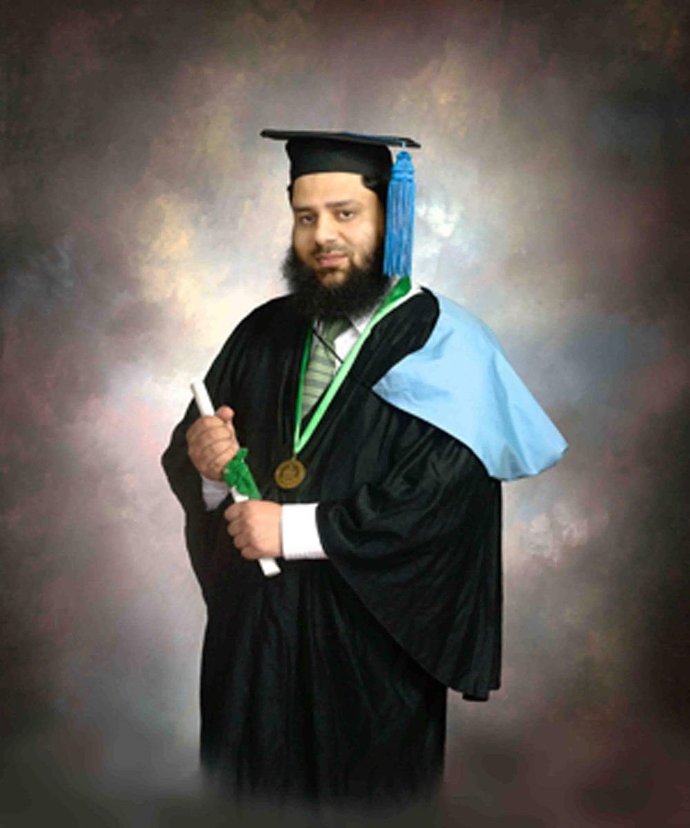 Dr. Ahmed Ejaz in graduation gown wearing his gold medal